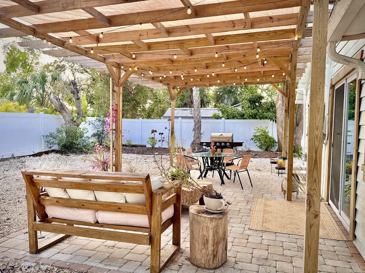 Backyard after — cedar pergola patio by Madeira Studios