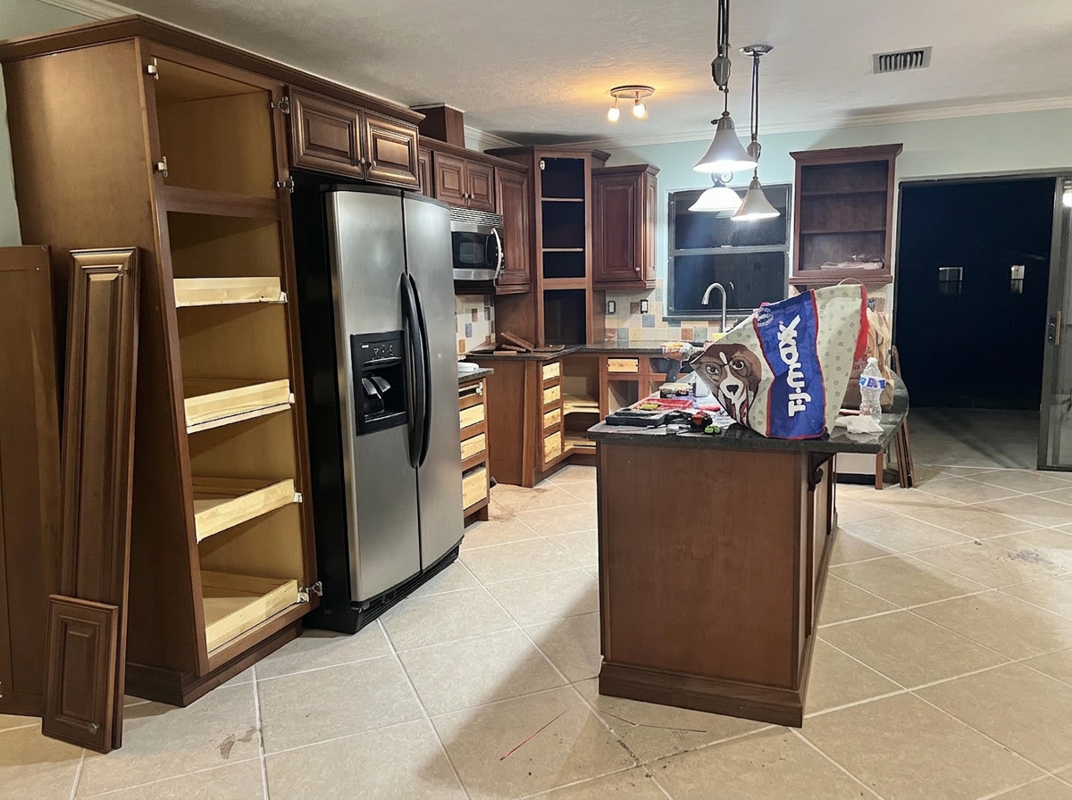 Kitchen before renovation with original dark wood cabinets